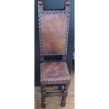 A Victorian Carved Oak Child's Correctional Chair with leather seat and back