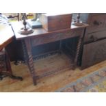 A Victorian Carved Oak Side table with single frieze drawer and barley twist legs