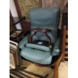 A Large Ekorness Green Leather Reclining Armchair with stool