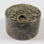 A Victorian Silver Pill Pot with embossed floral decoration and aperture for pill opening by