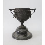 A Nineteenth Century Cast Bronze Two Handled Urn on serpentine stand, 21cm tall