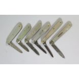 Four Small Silver and Mother of Pearl Fruit Knives and two others