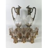 A German .800 Silver Gilt Twin Wine Ewer Set with twelve matching silver and glass beakers,