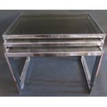 A 1960's Howard Miller Style Chrome Nest of Three Tables with smoked glass tops