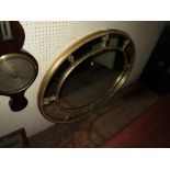 A Large Gilt Framed Oval Wall Mirror, 110cm wide