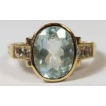 14ct Yellow Gold Aquamarine and Diamond ring featuring, one oval cut, light blue Aquamarine (2.