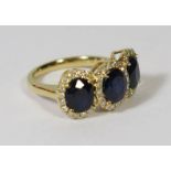 18ct Yellow Gold Sapphire and Diamond ring featuring centre, 3 oval cut KASHMIR Sapphires (4.18ct