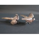 A Pair of German Sterling Silver Pheasants with UK import marks for London 1966, 19cm long (one tail