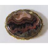 A 19th Century Agate and Rhodochrosite Brooch in a precious yellow metal setting, 38x31mm