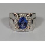 14ct White Gold Tanzanite and Diamond gents ring featuring centre, oval cut, medium blue