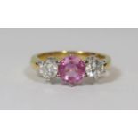 18ct Yellow and White Gold Sapphire and Diamond ring featuring centre, round cut pink Sapphire (0.