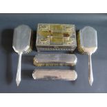 A Mappin and Webb Four Brush Dressing Table Set, silver plated box and sugar tongs