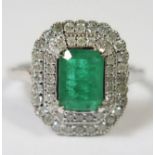 18ct White Gold Emerald and Diamond ring featuring centre, emerald cut, vivid green Emerald (1.