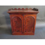 A 19th Century French Flame Mahogany Stationery Cupboard with twin arcaded doors, 37.5(w) x 39.5(