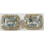 14ct Yellow Gold Aquamarine and Diamond stud earrings feature, x2 emerald cut, light blue Aquamarine