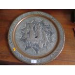 An Asian Embossed Tin Flashed Copper Charger decorated with figures, animals and stylised foliage,