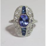 18ct White Gold Tanzanite, Sapphire and Diamond ring featuring centre, oval cut, violet blue