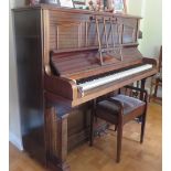 Steinway (c1912) A Vertegrand upright piano in a mahogany case; together with a stool.