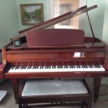 Gebr Niendorf (c1985) A 4ft 7in grand piano in a satin mahogany case on square tapered legs.