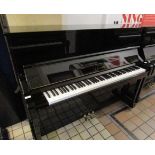 Yamaha (c2000) A 121cm Model YM10 upright piano in a bright ebonised case.