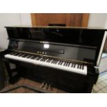 Miki by Yamaha A Model M10 upright piano in an ebonised case.