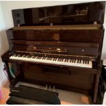 Yamaha (c1996) A Model P116N upright piano in a bright mahogany case; together with a stool.