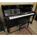 Kawai (c2016) A Model K-200 upright piano in a bright ebonised case; together with a stool.
