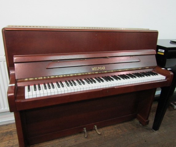 Welmar (c1971) A 112cm upright piano in a satin mahogany case. AMENDMENT Is (c1972).