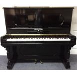 Steinway (c1900) A New York Model F upright piano in an ebonised case.