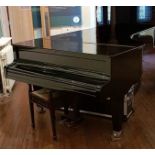 Estonia (c1975) A 9ft concert grand piano in a bright ebonised case on square tapered legs;