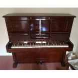 Bechstein (c1926) A Model 10 upright piano in a mahogany case; together with a stool.