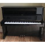 Yamaha No (c1976) A Model U1 upright piano in a bright ebonised case.