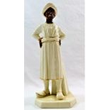 A Worcester porcelain figure of an Indian gentleman standing with his hands on his hips,