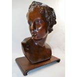 A 19th Century carved mahogany bust of a young man in the classical manner, 30cm high,