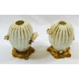 A pair of small Victorian Moore Brothers porcelain cactus vases, on gilt bases, 8.