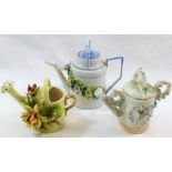 A 19th century Continental miniature porcelain watering can, decorated in relied with a floral swag,