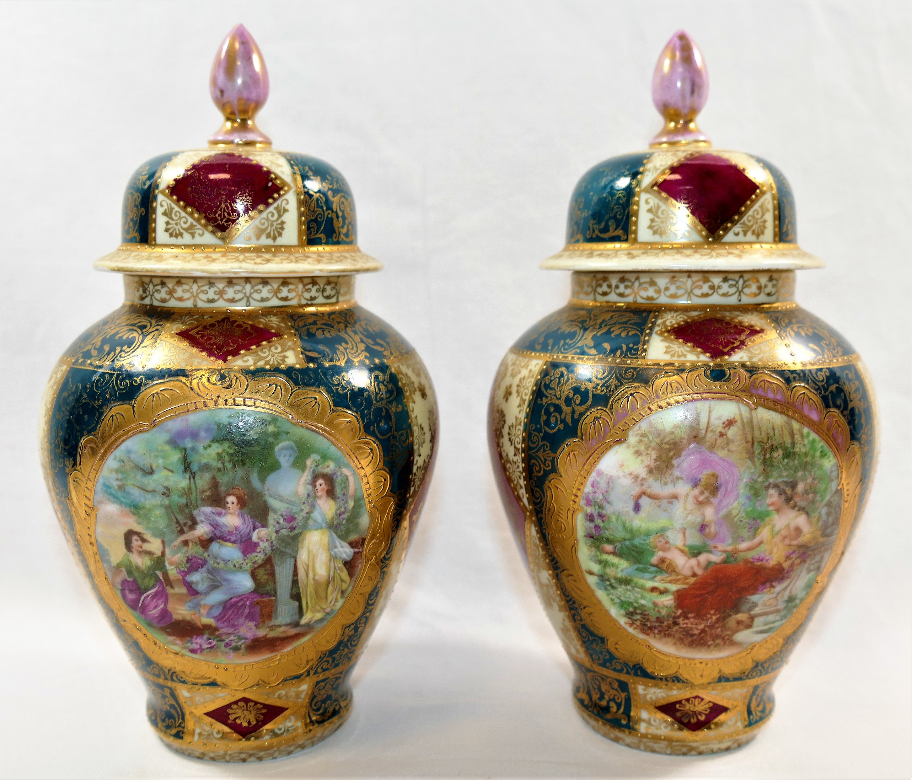 A pair porcelain lidded vases, with transfer decorated figural scenes and green,
