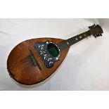 An Italian rosewood and boxwood strung mandolin, with tortoiseshell,