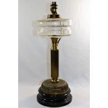 A Victorian oil lamp, with reeded column and panel cut glass reservoir, converted to electricity,