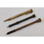 A Victorian pinchbeck propelling pen and pencil, with bloodstone seal top, 9cm long, an S.