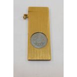 A 9 carat gold cased steel cigar cutter, with reeded decoration, London 1967, 5.4cm long, case 16.