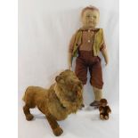 A vintage nodding lion, 25.5cm long, a Schuco miniature monkey, 8.