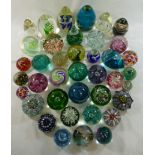 A collection of 39 paperweight including a limited edition Caithness Glass paperweight by Peter