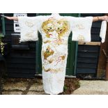 A 20th century Chinese cream kimono robe, embroidered with dragons,