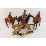 A set of scratch built carved wood and hand painted figures comprised of three huntsmen and horses,