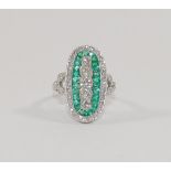 An emerald and diamond oval panel ring,