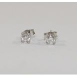 A pair of 18 carat white gold diamond stud earrings,