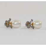 A pair of cultured pearl and diamond drop earrings,