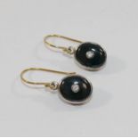 A pair of onyx and diamond oval drop earrings,