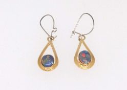 A pair of opal pendant drop earrings set in yellow metal, boxed.